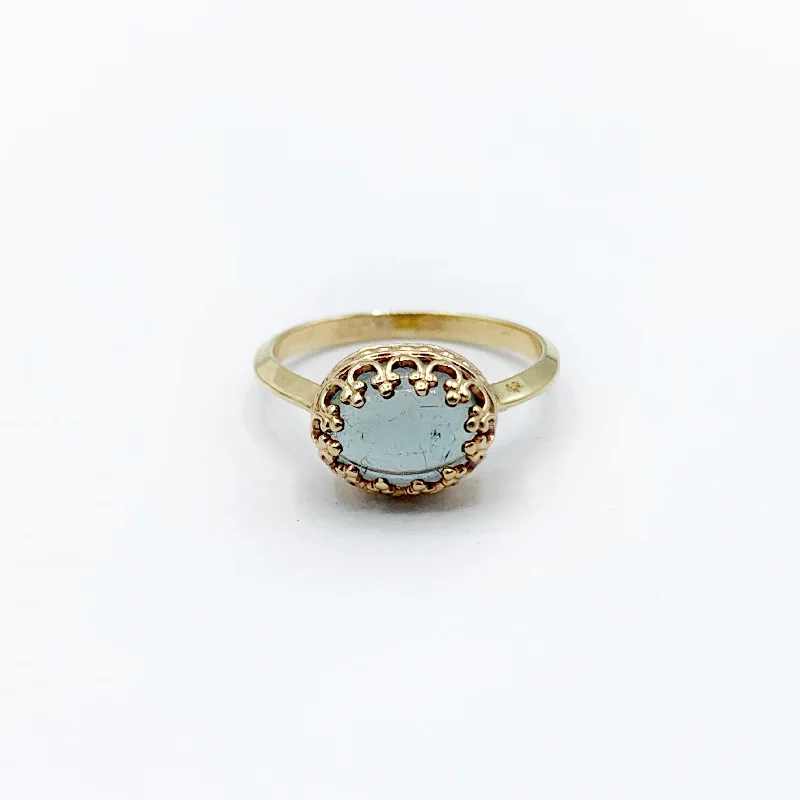 cushion-cut ladies ring-Soft Blue Tourmaline Surrounded by Golden Stars