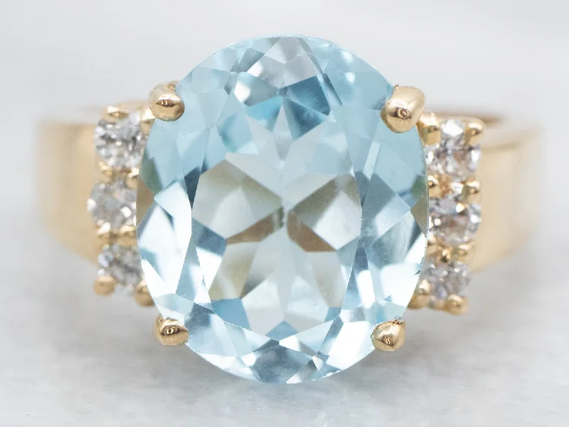 statement fashion engagement ring for women-Modern Gold Blue Topaz and Diamond Ring